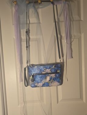Reed Modern Blue Floral Crossbody Wristlet with Black Strap